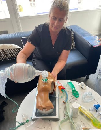 e-ILS e-PILS training session showing airway management and bag-valve mask ventilation on a manikin